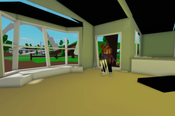 “Close-up of child’s hands holding smartphone with Roblox on screen”